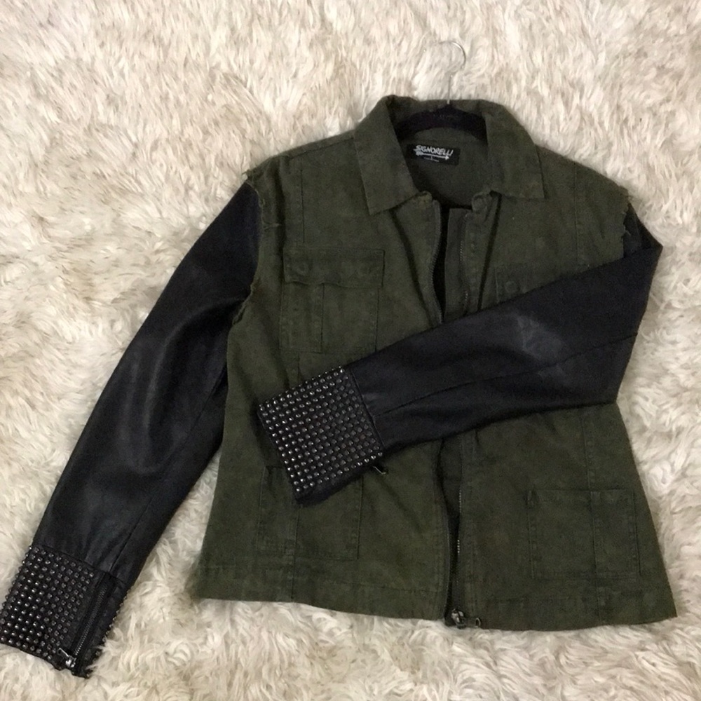 Light jacket with leather arms and studs